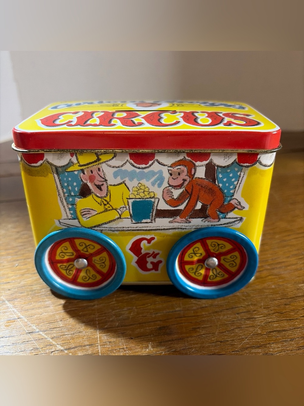 Vintage 1995 Curious George Circus Tin Coin Bank Schylling H.A. Rey Wheels